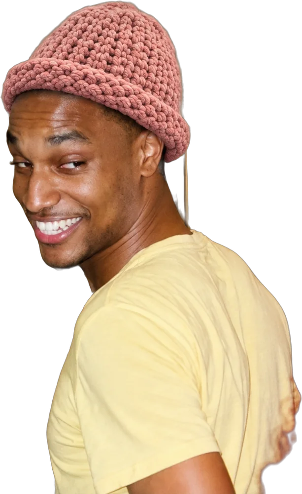 Nigga grinning over his shoulder in the pink hat
